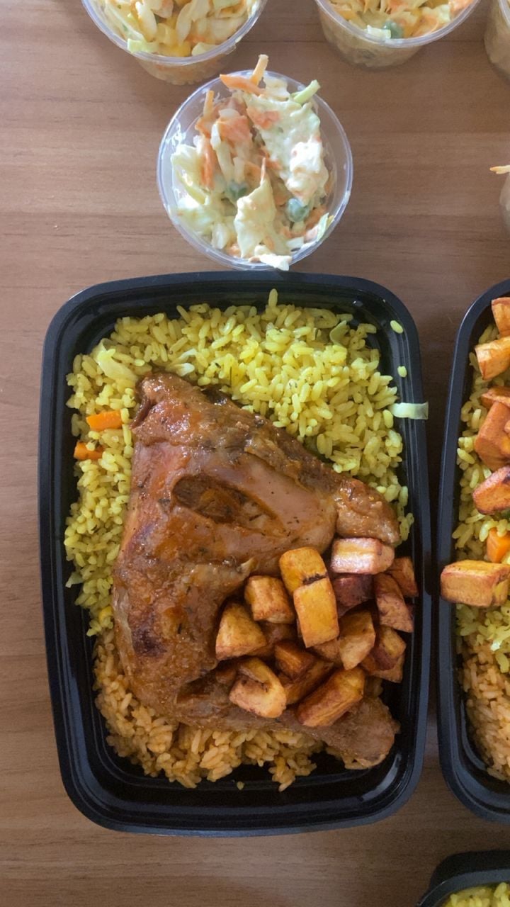 Jollof and fried rice with chicken lap